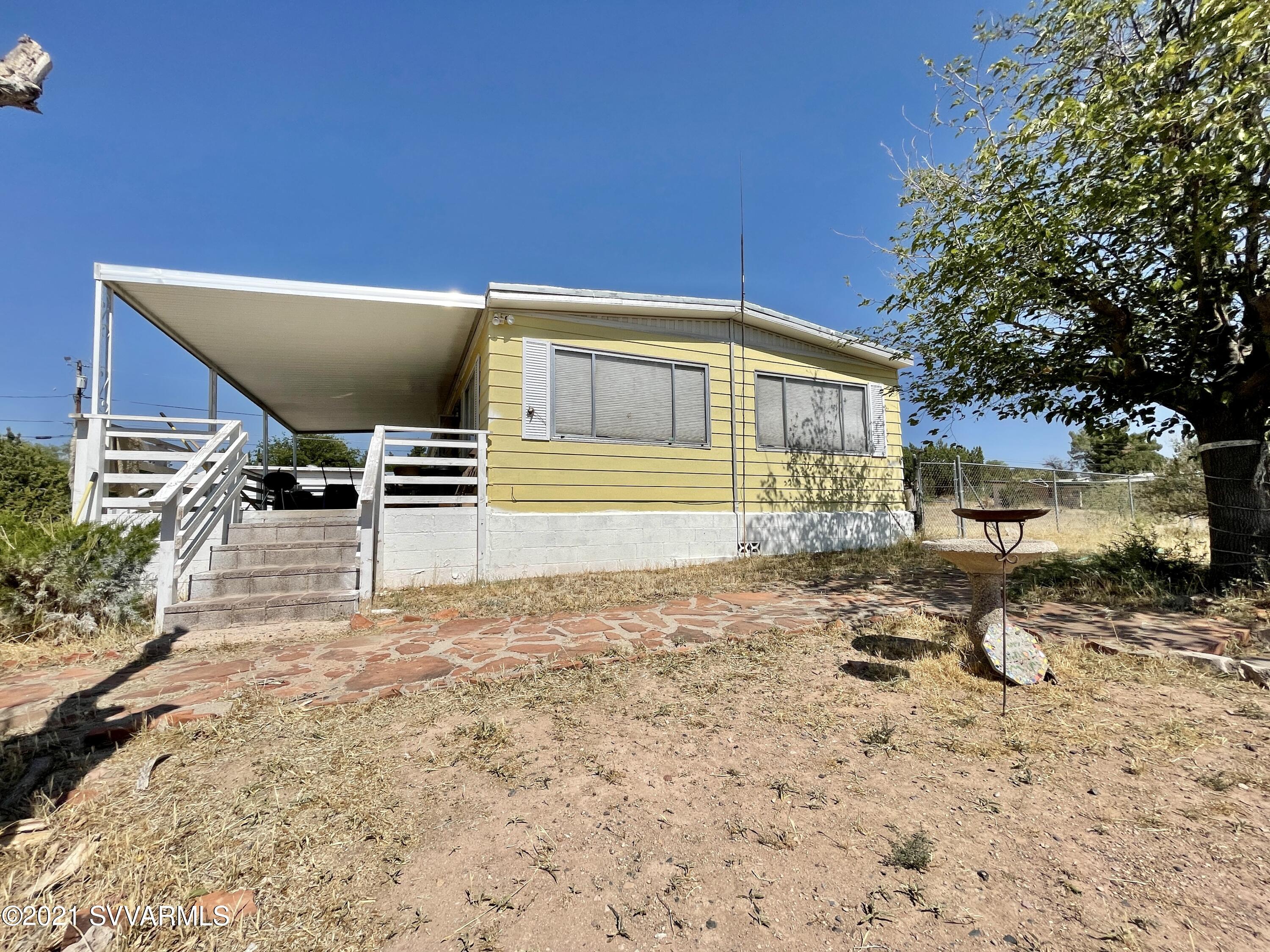 4905 Ho Hum Trail Rimrock, AZ 86335 - Photo 1 of 16 a front view of a house with garden