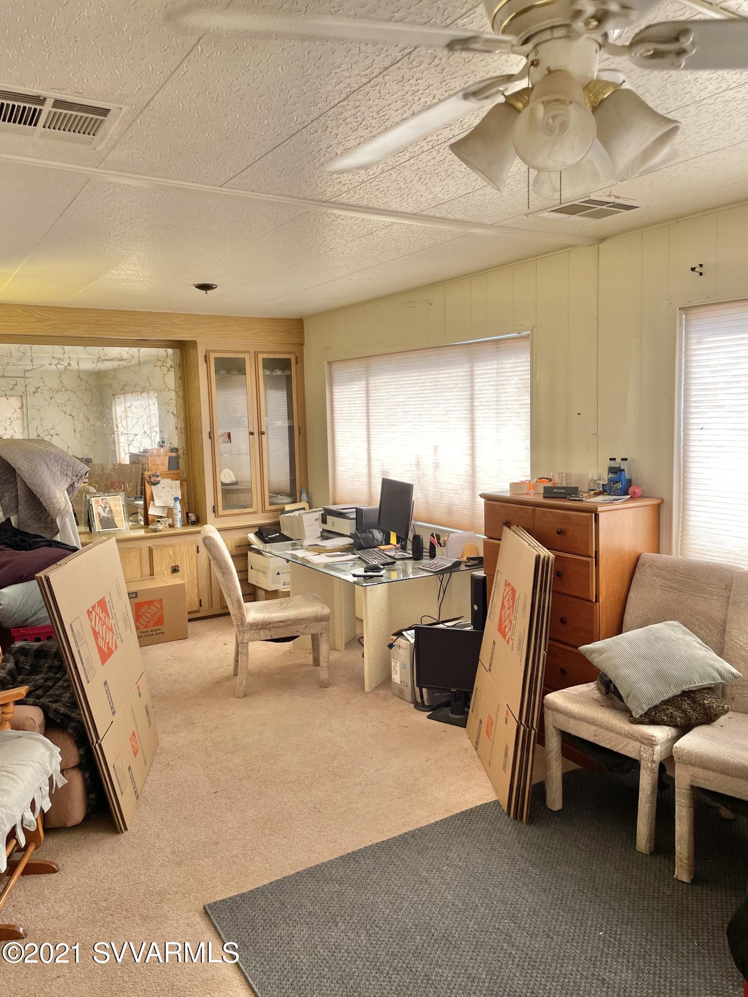 4905 Ho Hum Trail Rimrock, AZ 86335 - Photo 14 of 16 a living room with furniture window and a chandelier