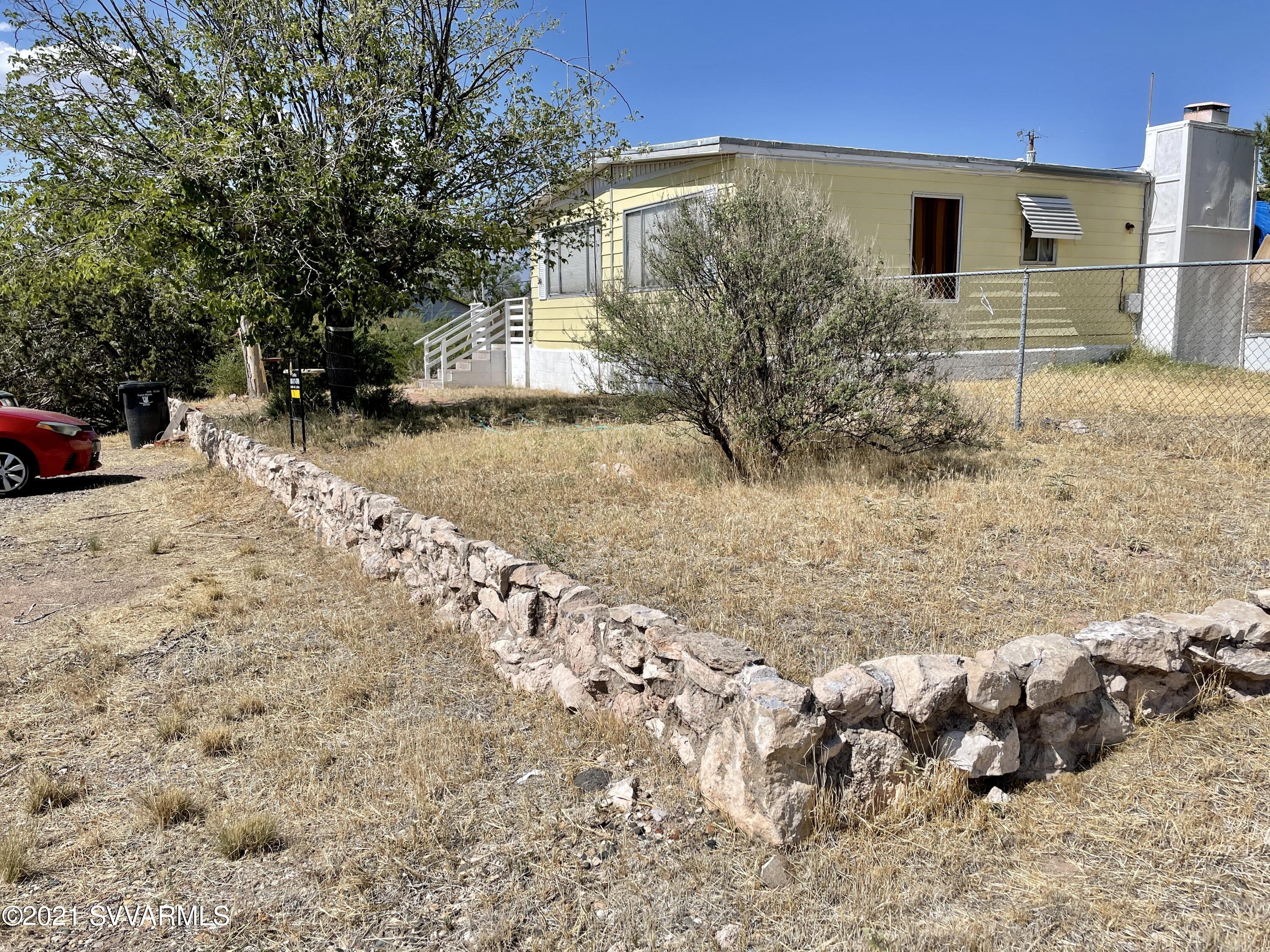 4905 Ho Hum Trail Rimrock, AZ 86335 - Photo 3 of 16 a front view of a house with a yard