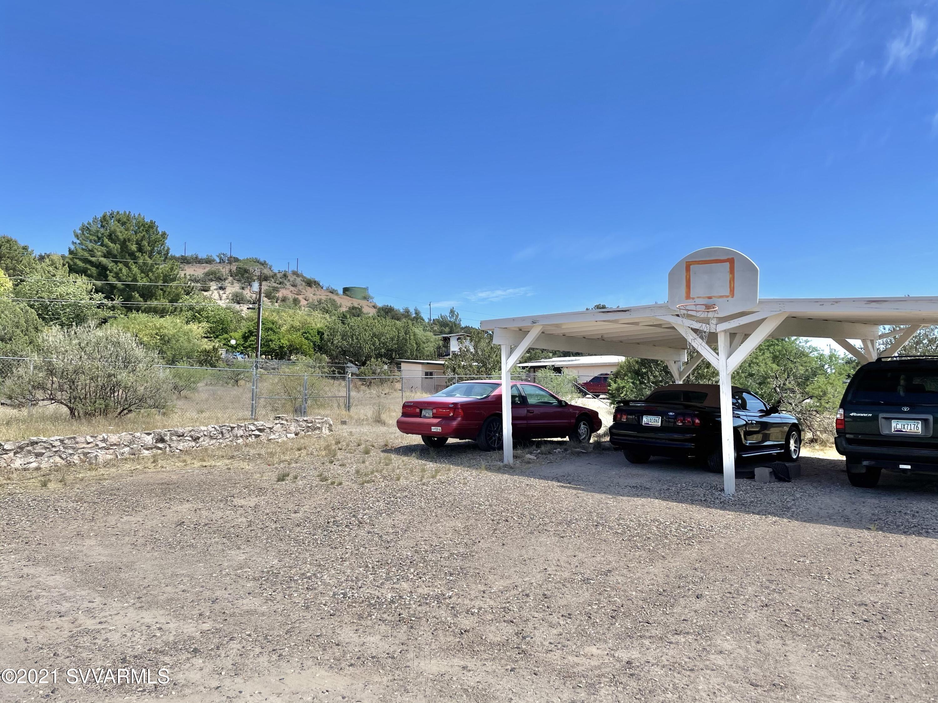 4905 Ho Hum Trail Rimrock, AZ 86335 - Photo 7 of 16 a view of cars parked in a parking lot