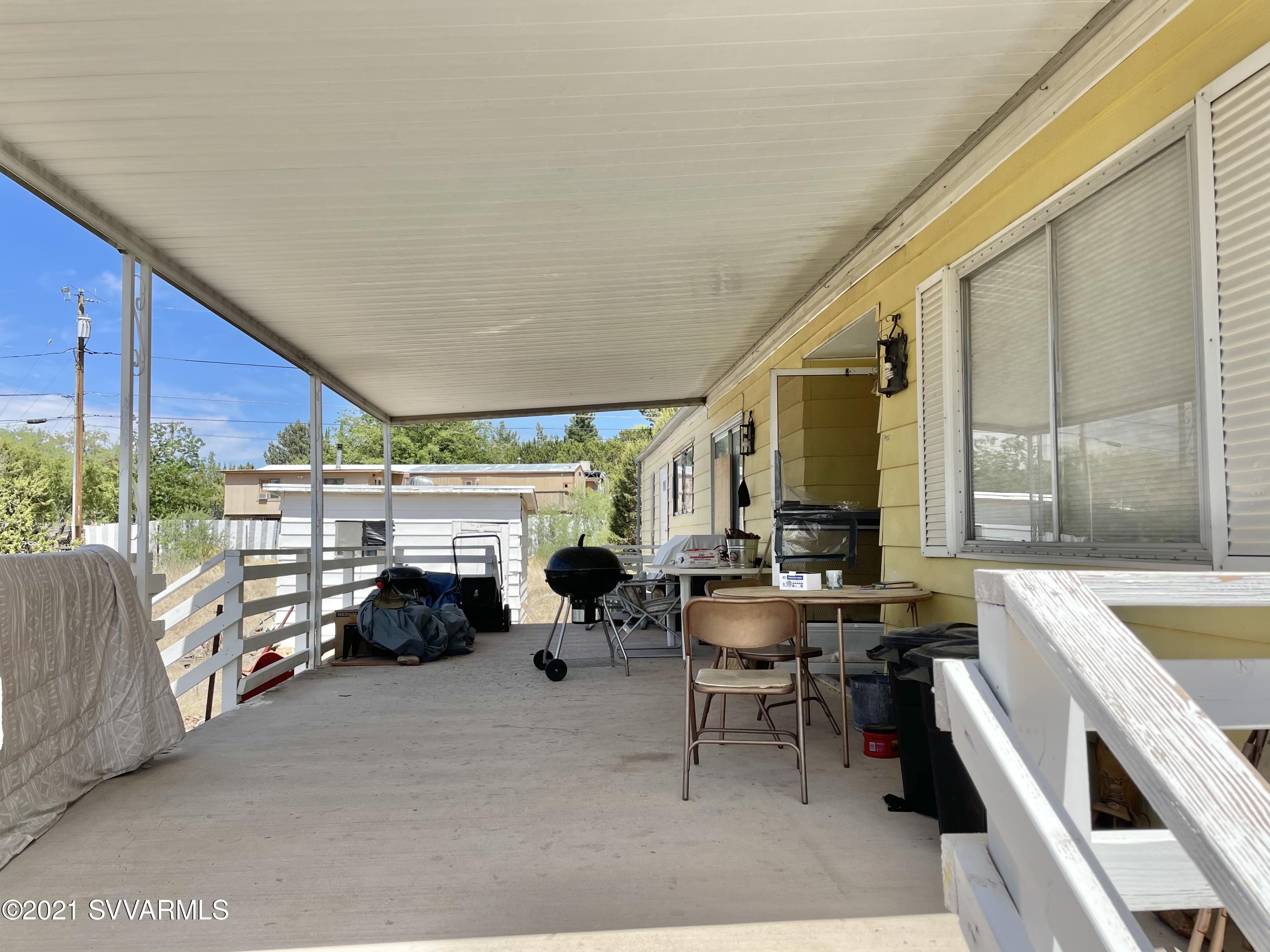 4905 Ho Hum Trail Rimrock, AZ 86335 - Photo 9 of 16 a group of chairs sitting in patio of a house