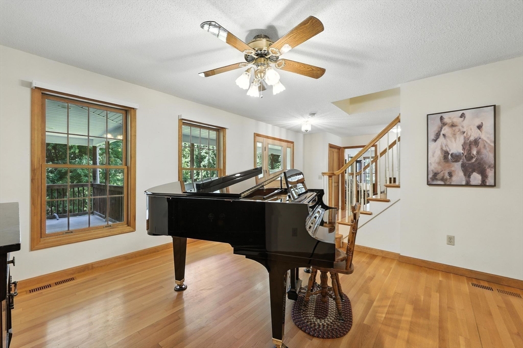 285 Lower Hampden Road Monson, MA 01057 - Photo 9 of 40 a view of a livingroom with furniture and a ceiling fan