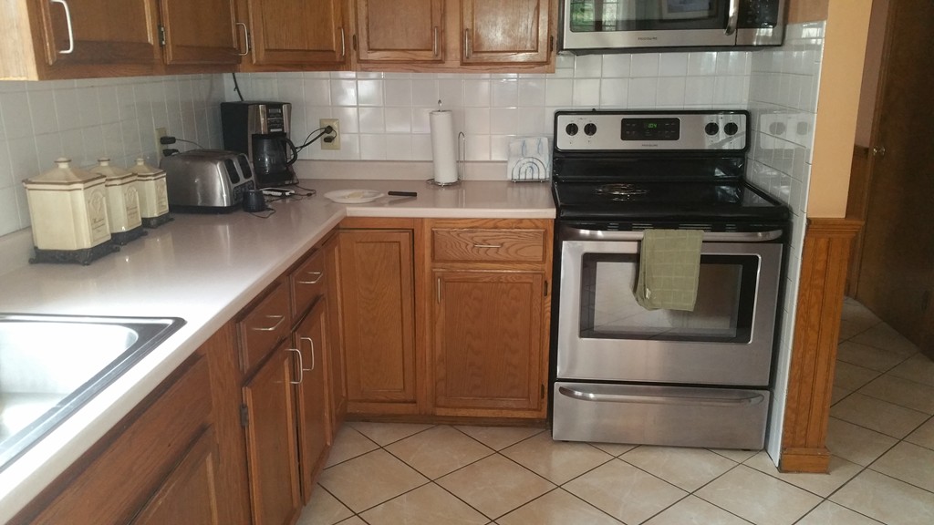 227 Torrey Road Southbridge, MA 01550 - Photo 17 of 30 a kitchen with a stove and a microwave