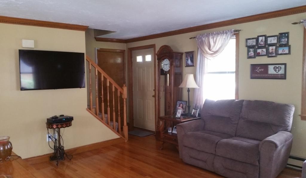 227 Torrey Road Southbridge, MA 01550 - Photo 21 of 30 a living room with furniture and a flat screen tv
