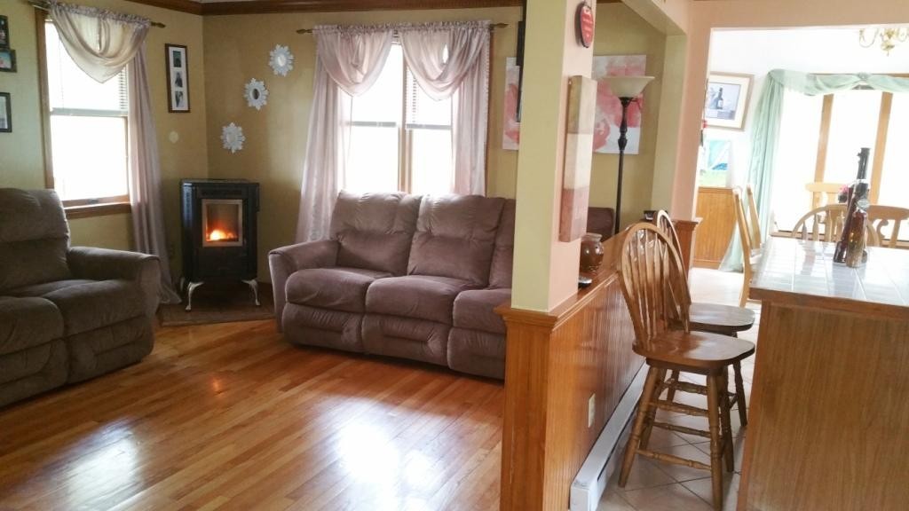 227 Torrey Road Southbridge, MA 01550 - Photo 23 of 30 a living room with furniture and a fireplace