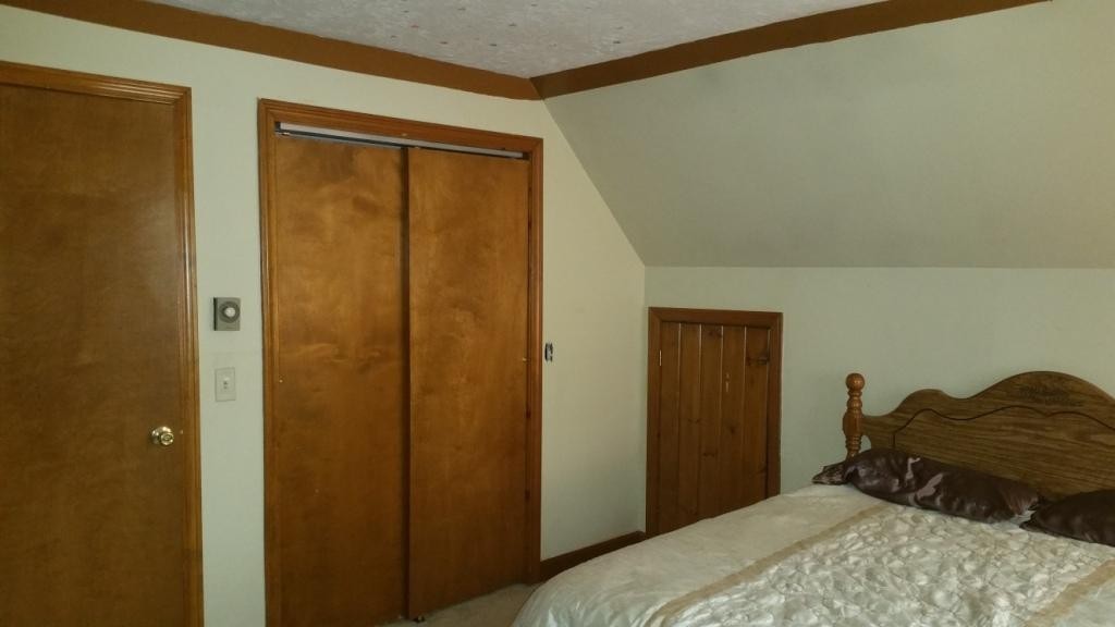 227 Torrey Road Southbridge, MA 01550 - Photo 24 of 30 a bedroom with a bed and a mirror