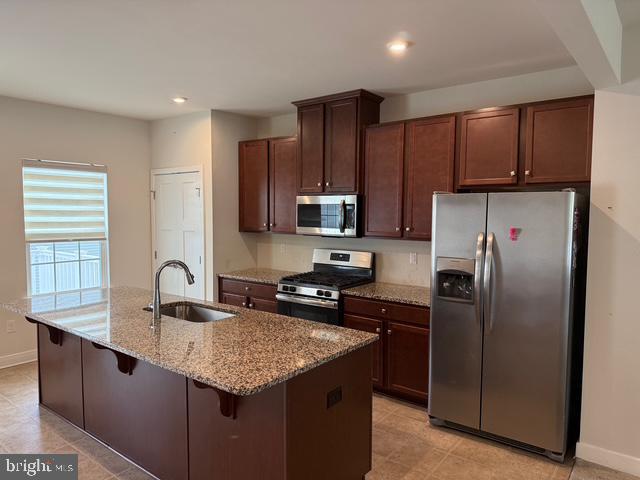 33 Peacock Circle Sewell, NJ 08080 - Photo 3 of 26 a kitchen with stainless steel appliances granite countertop a refrigerator a sink a stove a microwave and wooden cabinets