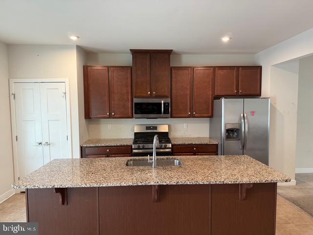 33 Peacock Circle Sewell, NJ 08080 - Photo 4 of 26 a kitchen with granite countertop a refrigerator a stove a sink and cabinets