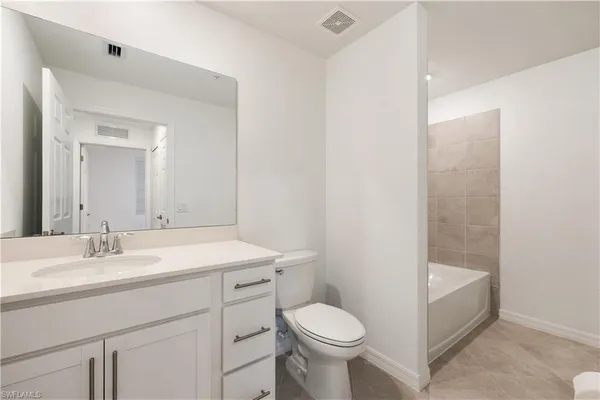a bathroom with a sink toilet and vanity