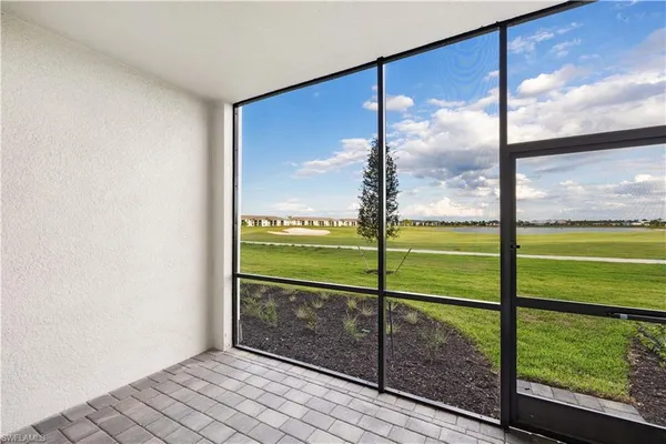a view of a room with yard from a window