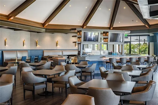 a group of people sitting at tables in a room