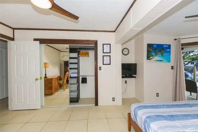 a bedroom with a bed and a mirror