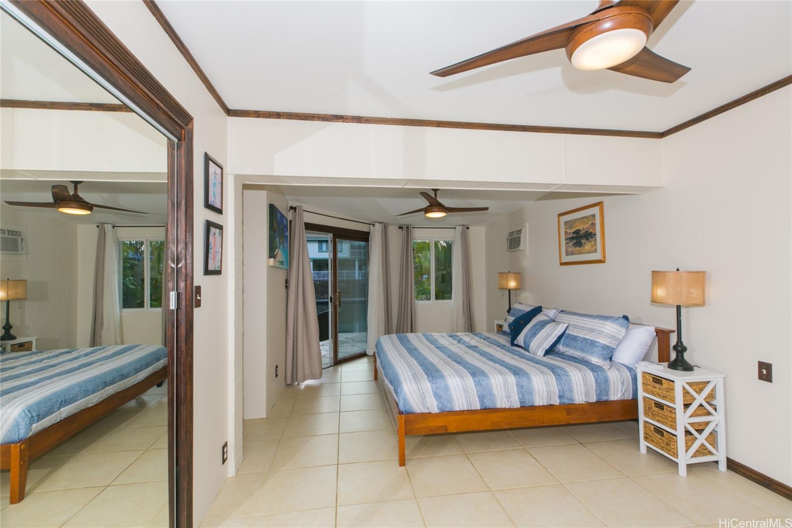 6266 Keōkea Place Honolulu, HI 96825 - Photo 13 of 25 a bedroom with furniture and a window