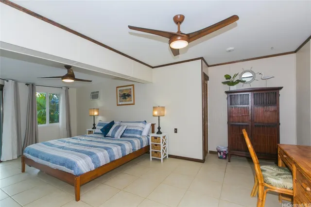 a bedroom with a bed and a desk