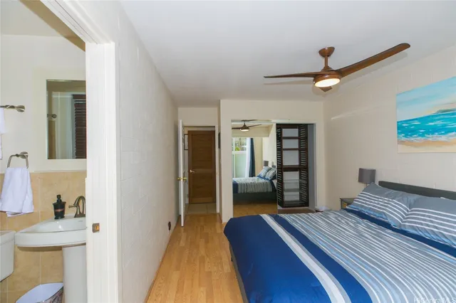 a bedroom with a bed and a view of bathroom