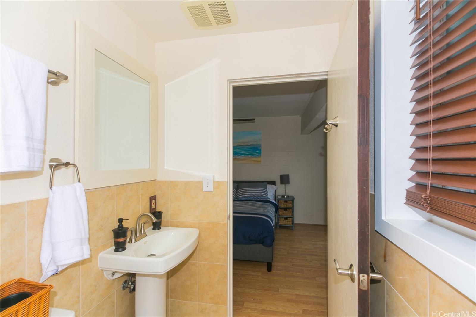 6266 Keōkea Place Honolulu, HI 96825 - Photo 22 of 25 a bathroom with a sink and a mirror