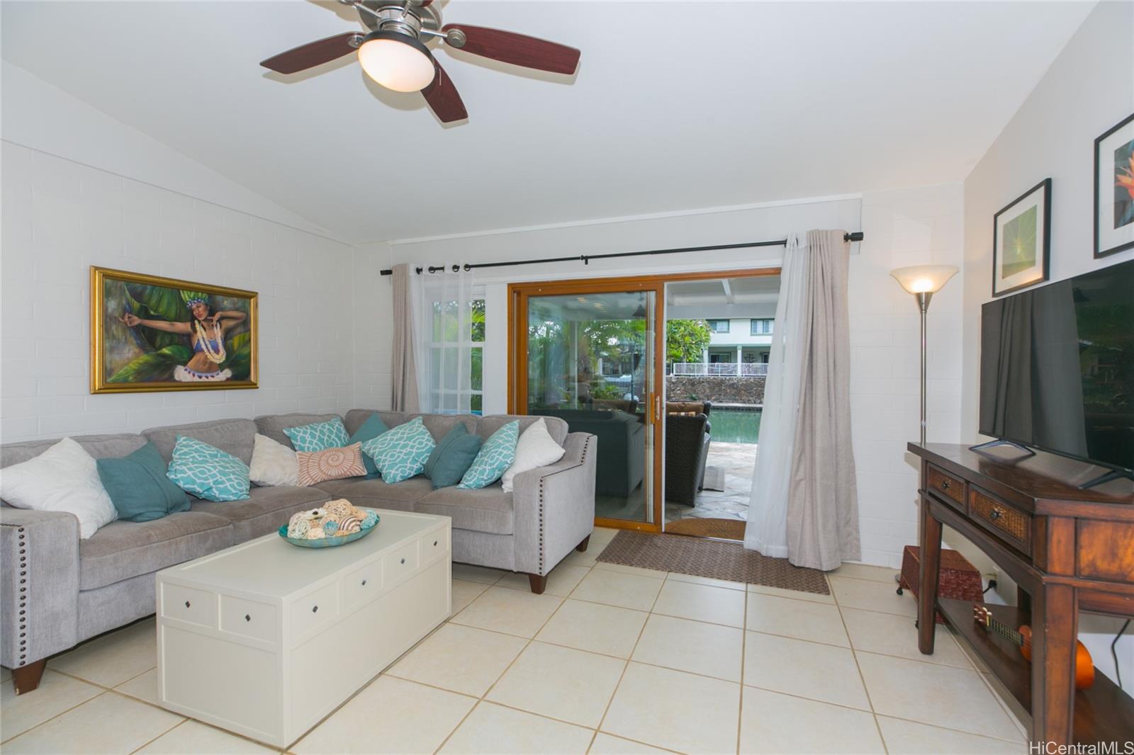 6266 Keōkea Place Honolulu, HI 96825 - Photo 6 of 25 a living room with furniture and a flat screen tv