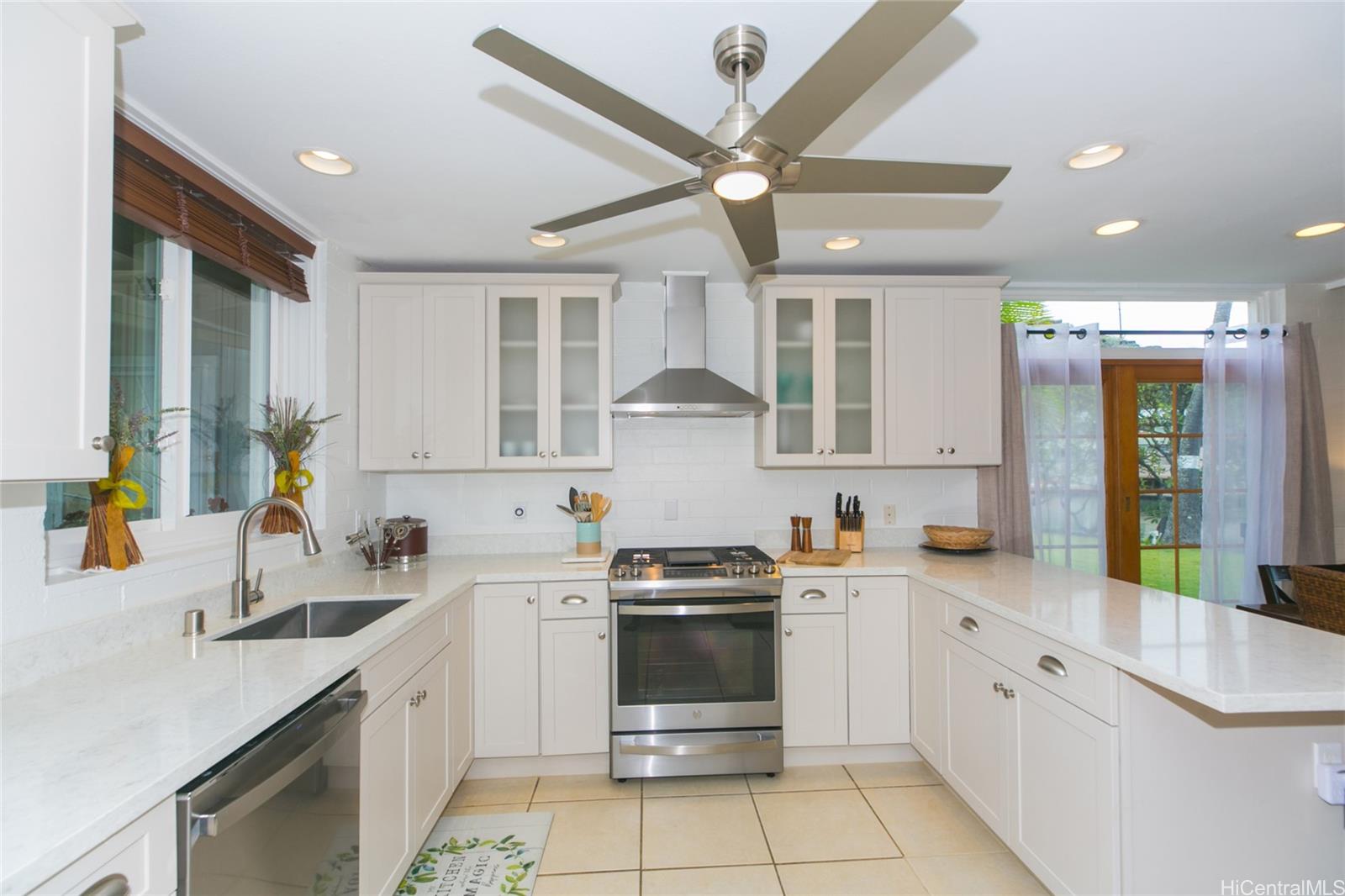 6266 Keōkea Place Honolulu, HI 96825 - Photo 10 of 25 a kitchen with a sink cabinets and window