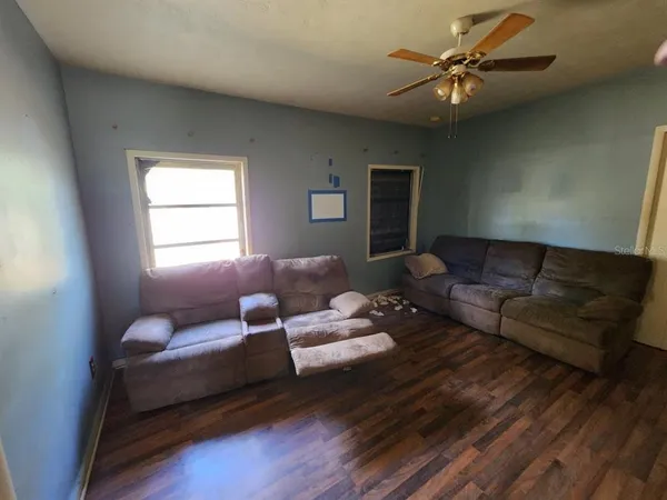 a living room with furniture and a window