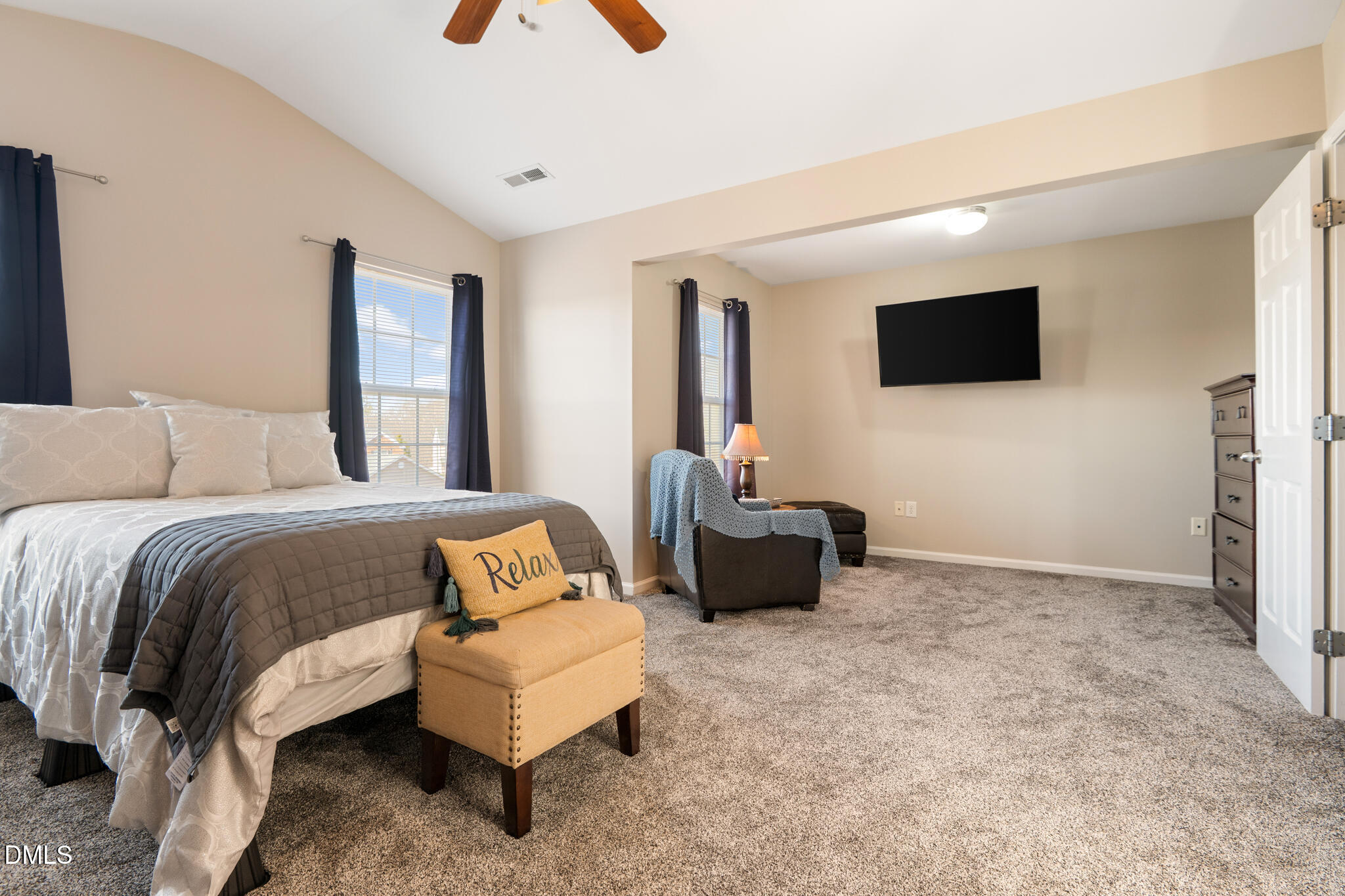 2019 Tennessee Road Durham, NC 27704 - Photo 16 of 28 a spacious bedroom with a bed and a flat screen television