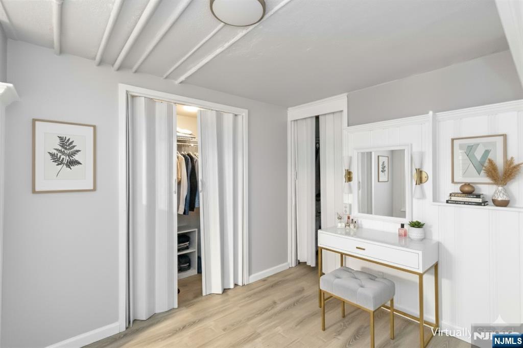 1283 Valley Road, Unit 7 Montclair, NJ 07043 - Photo 11 of 24 a view of a room with furniture and wooden floor