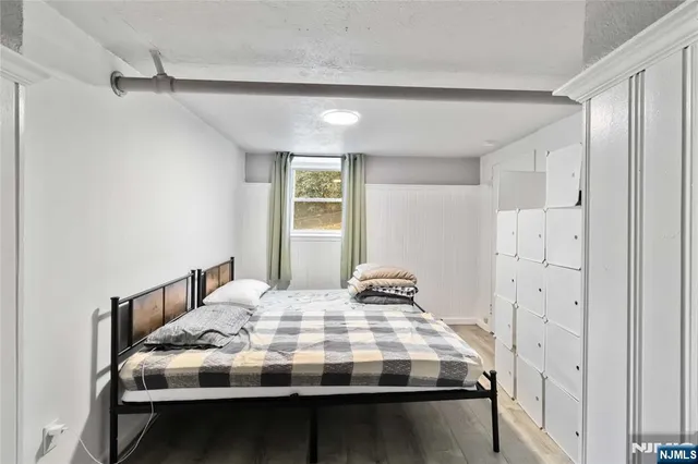 a bedroom with a bed and a table