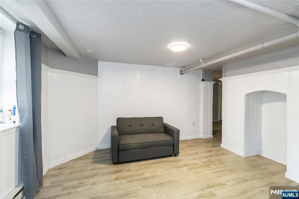 1283 Valley Road, Unit 7 Montclair, NJ 07043 - Photo 5 of 24 a room with a bed and a mirror