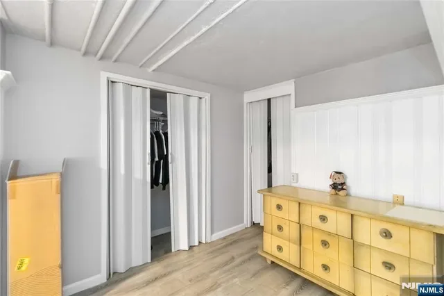 a bathroom with a sink a mirror and a window