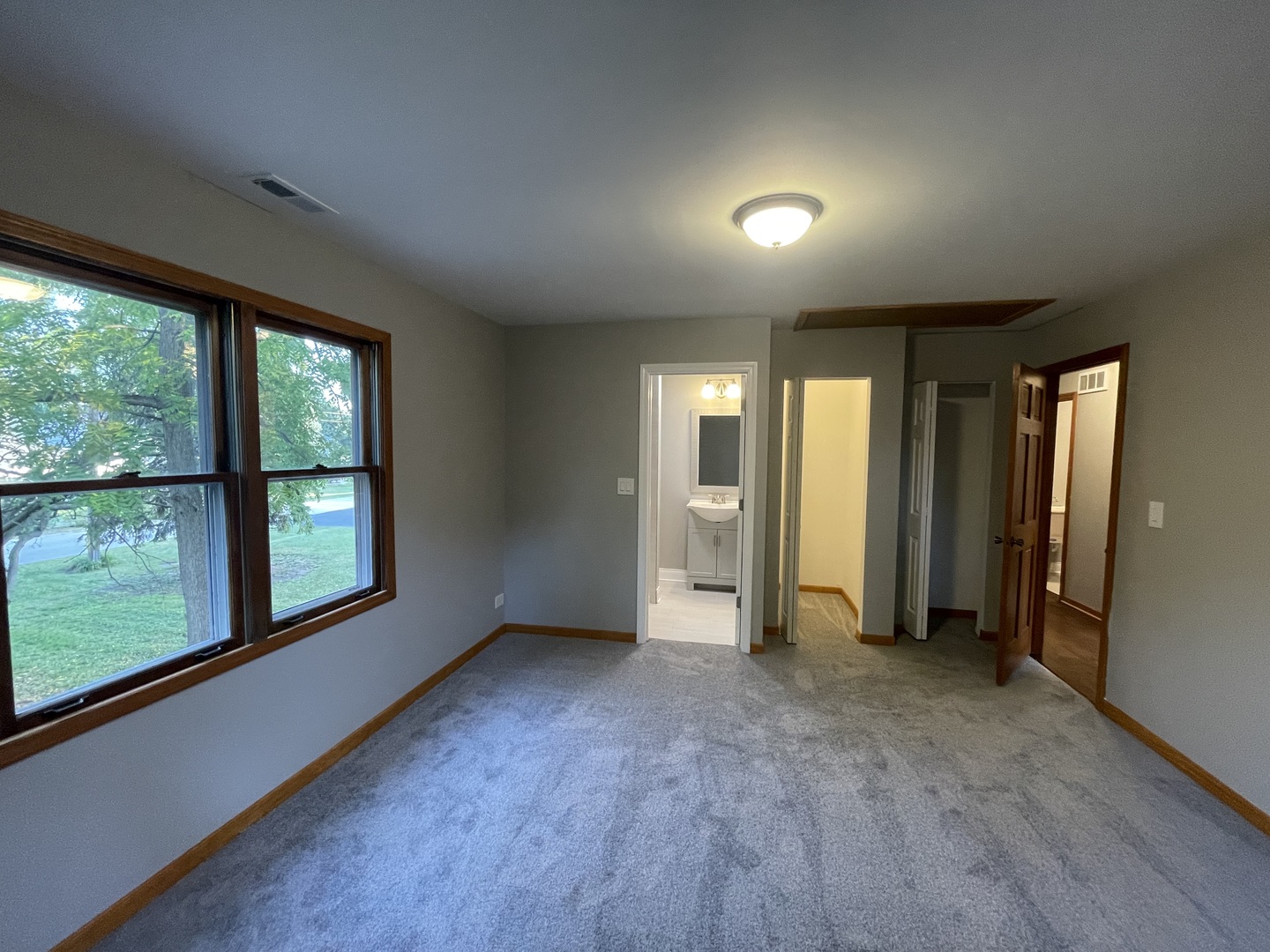 3-s284 Pattermann Road Warrenville, IL 60555 - Photo 13 of 21 an empty room with large windows and a yard