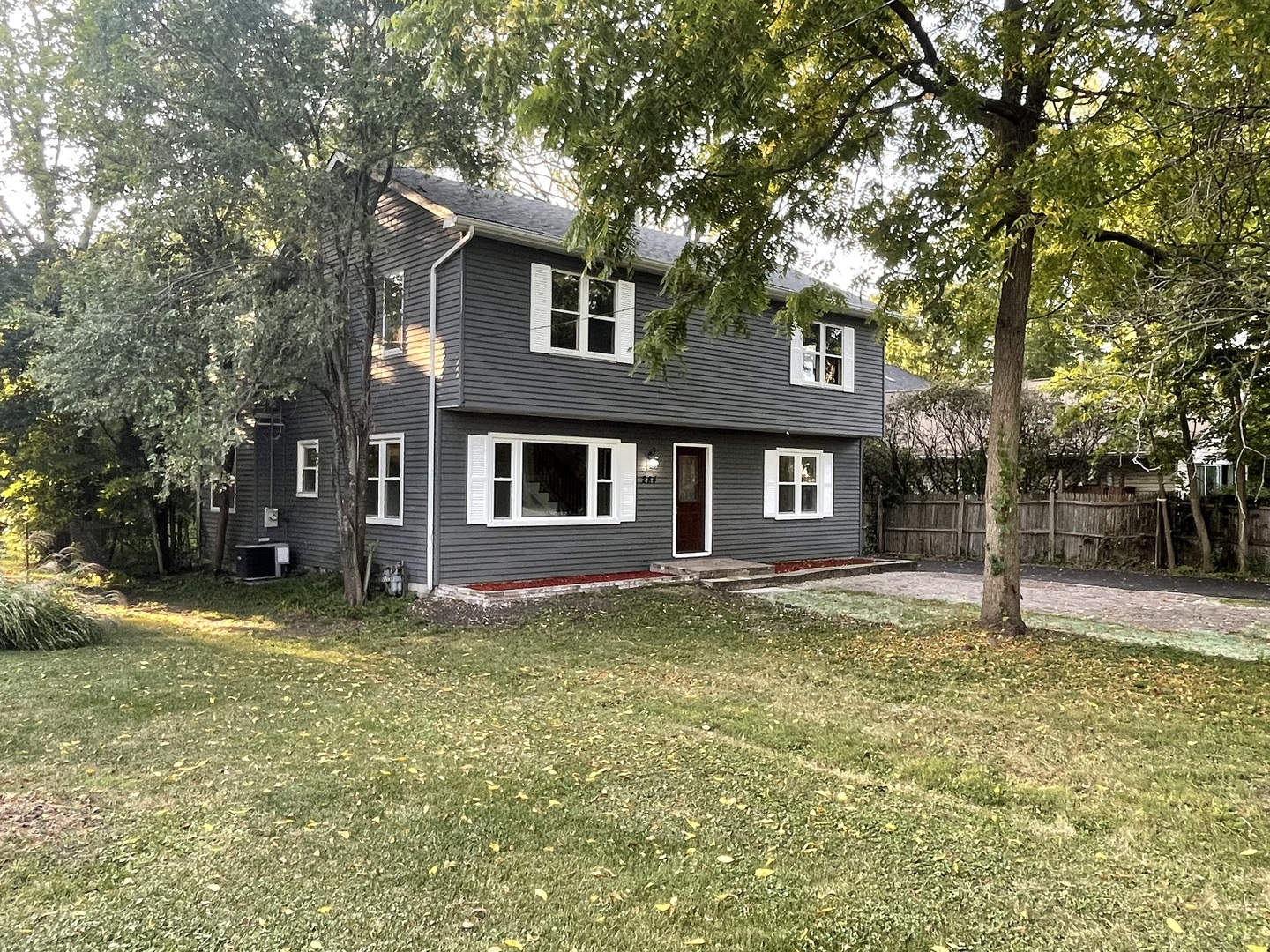 3-s284 Pattermann Road Warrenville, IL 60555 - Photo 2 of 21 a view of a yard in front of a house with large tree