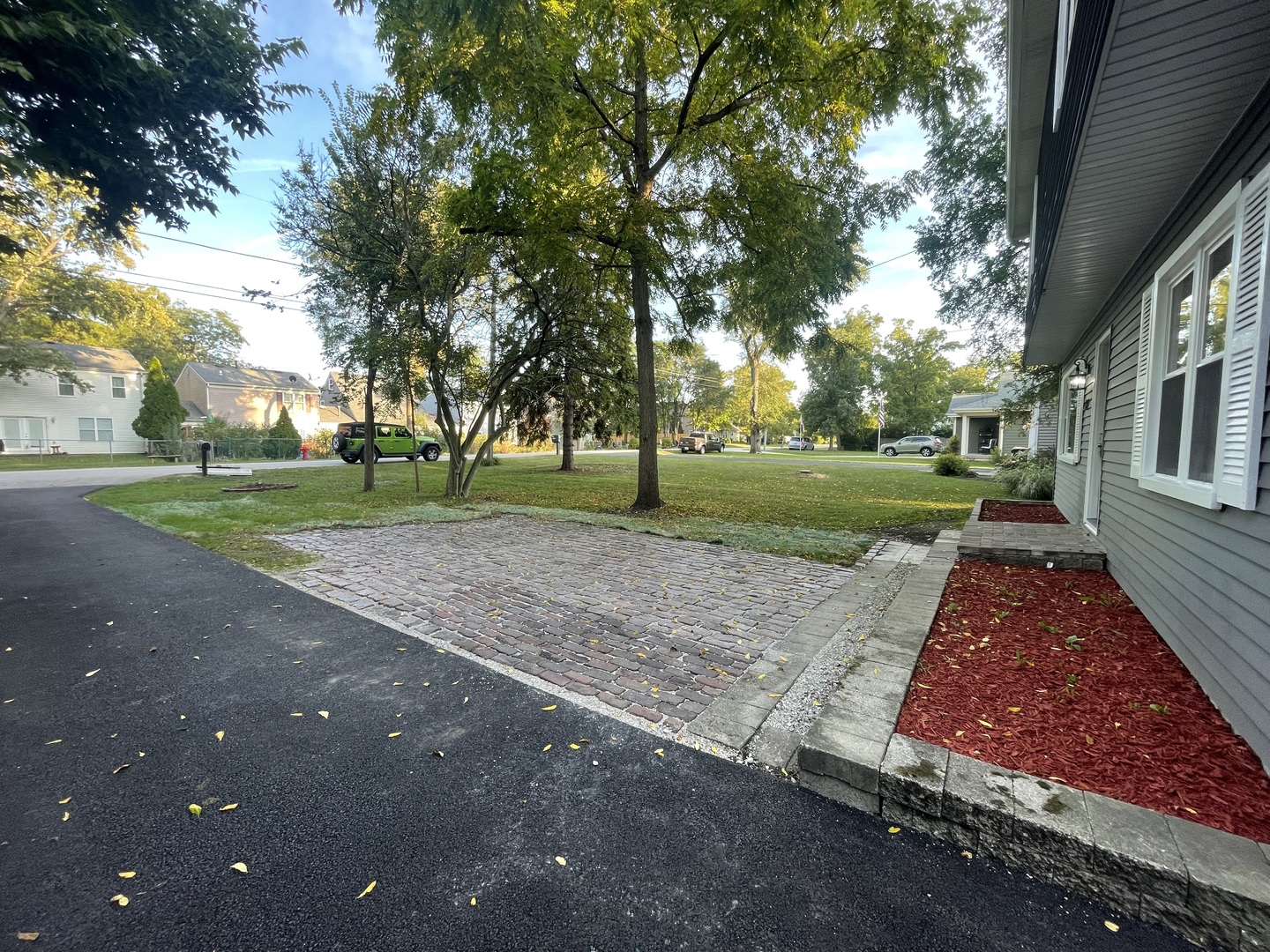3-s284 Pattermann Road Warrenville, IL 60555 - Photo 4 of 21 a view of road with a big yard and large trees