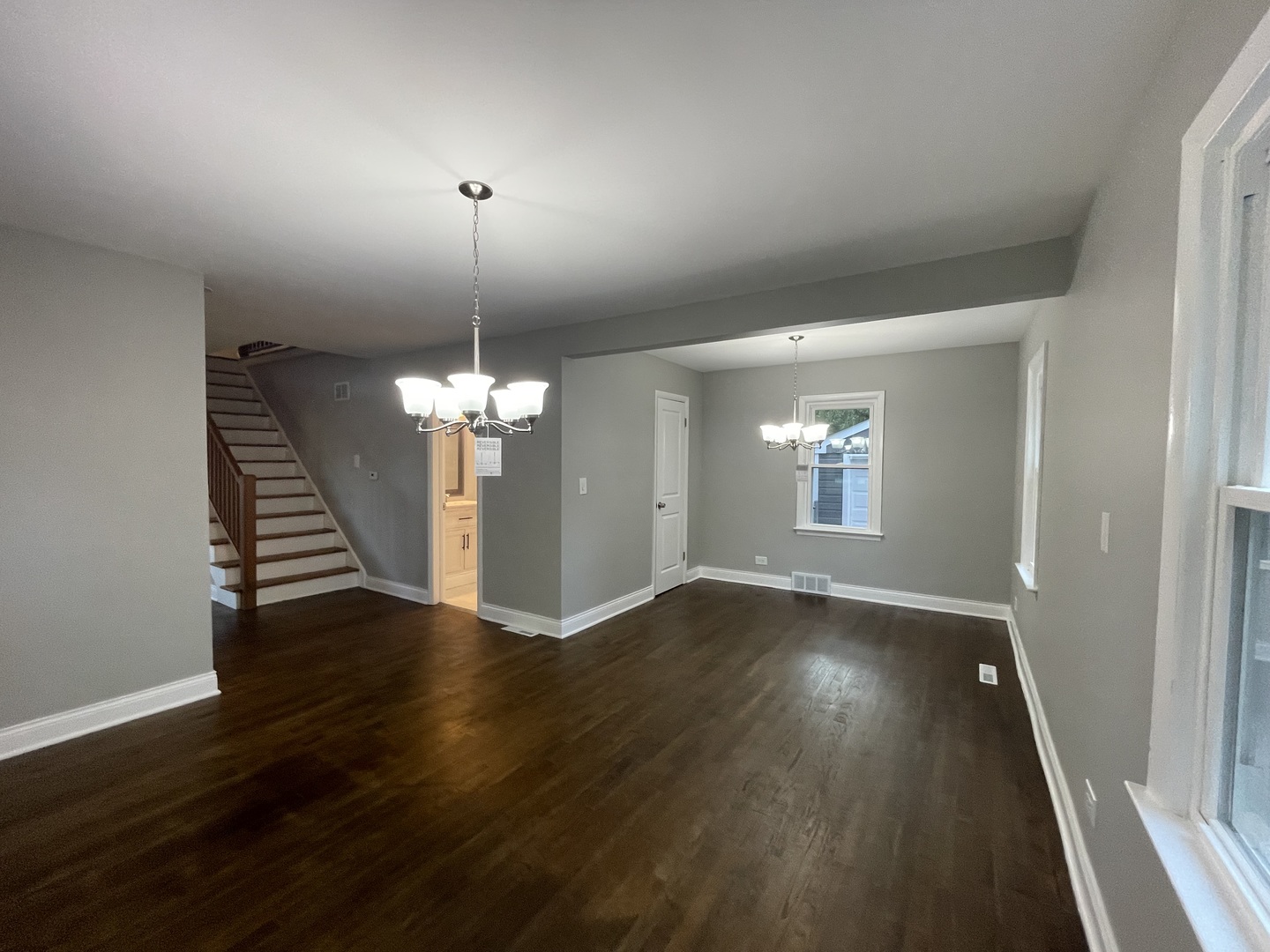 3-s284 Pattermann Road Warrenville, IL 60555 - Photo 6 of 21 a view of a room with wooden floor chandelier and a window