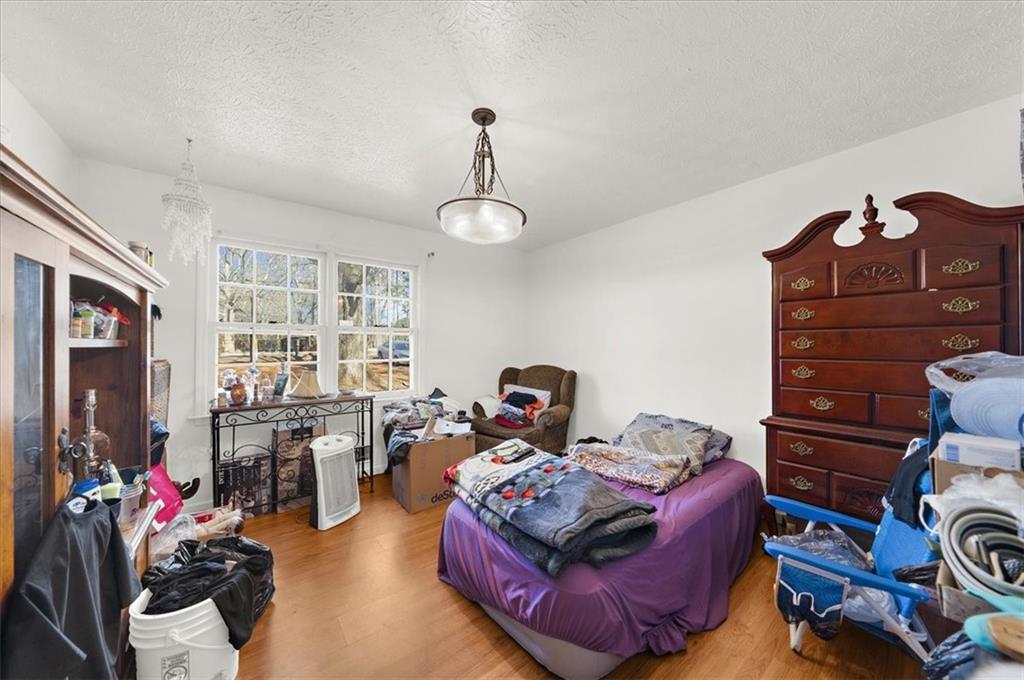 1059 Old Alabama Road Southwest Mableton, GA 30126 - Photo 20 of 33 a bed room with furniture and a book shelf