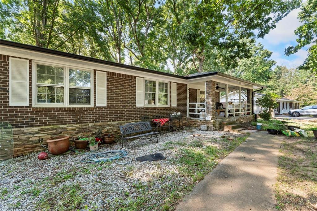 1059 Old Alabama Road Southwest Mableton, GA 30126 - Photo 2 of 33 a backyard of a house with seating space