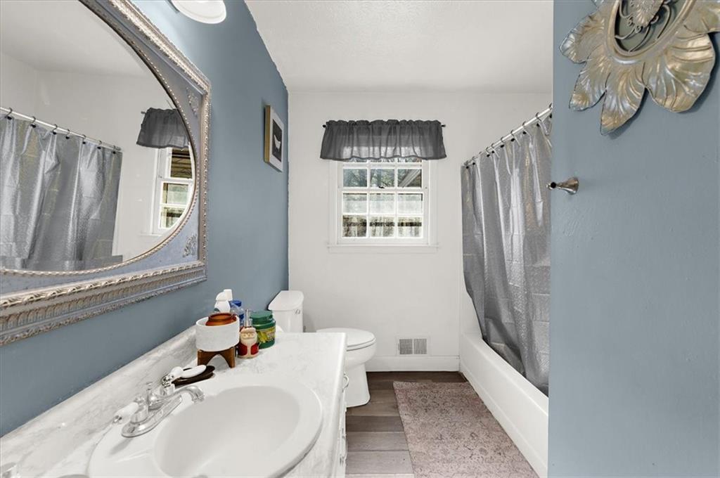 1059 Old Alabama Road Southwest Mableton, GA 30126 - Photo 22 of 33 a bathroom with a sink toilet and shower