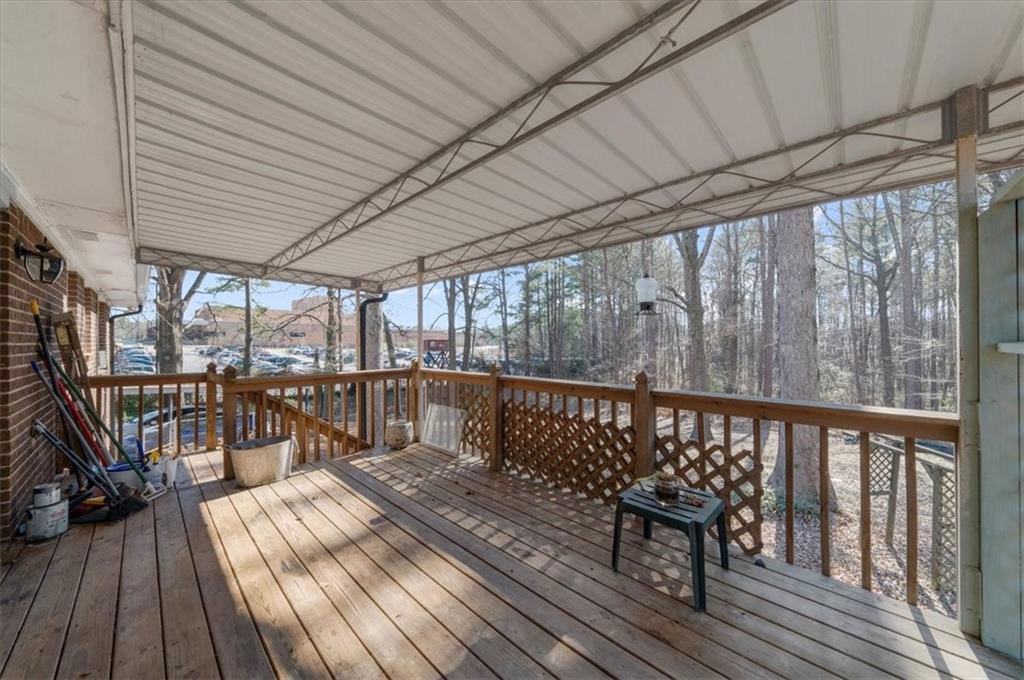 1059 Old Alabama Road Southwest Mableton, GA 30126 - Photo 28 of 33 a view of balcony with couch and wooden floor