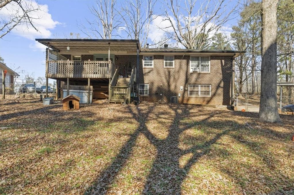 1059 Old Alabama Road Southwest Mableton, GA 30126 - Photo 29 of 33 a view of a house with large windows