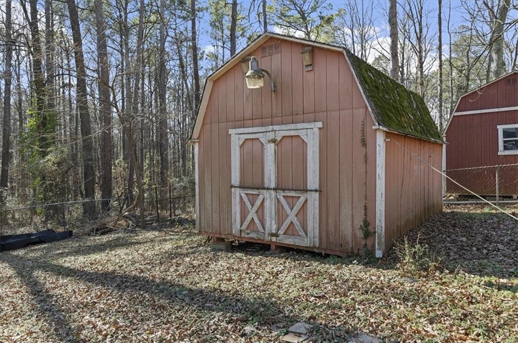 1059 Old Alabama Road Southwest Mableton, GA 30126 - Photo 32 of 33 a front view of a house with garden