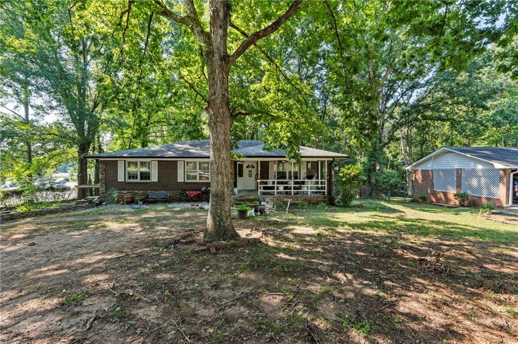 1059 Old Alabama Road Southwest Mableton, GA 30126 - Photo 4 of 33 a view of a house with a yard