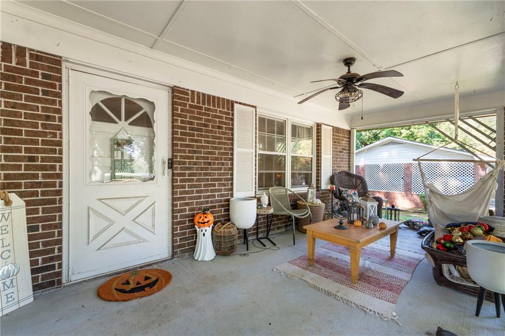 1059 Old Alabama Road Southwest Mableton, GA 30126 - Photo 5 of 33 a living room with furniture and a chandelier
