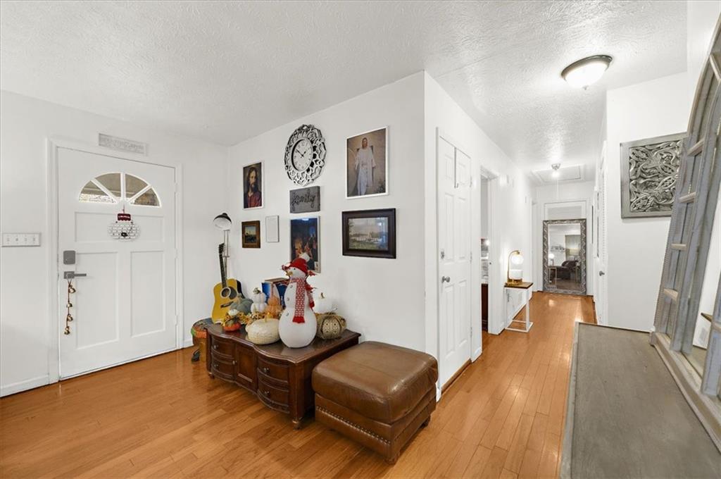 1059 Old Alabama Road Southwest Mableton, GA 30126 - Photo 6 of 33 a living room with furniture and a wooden floor