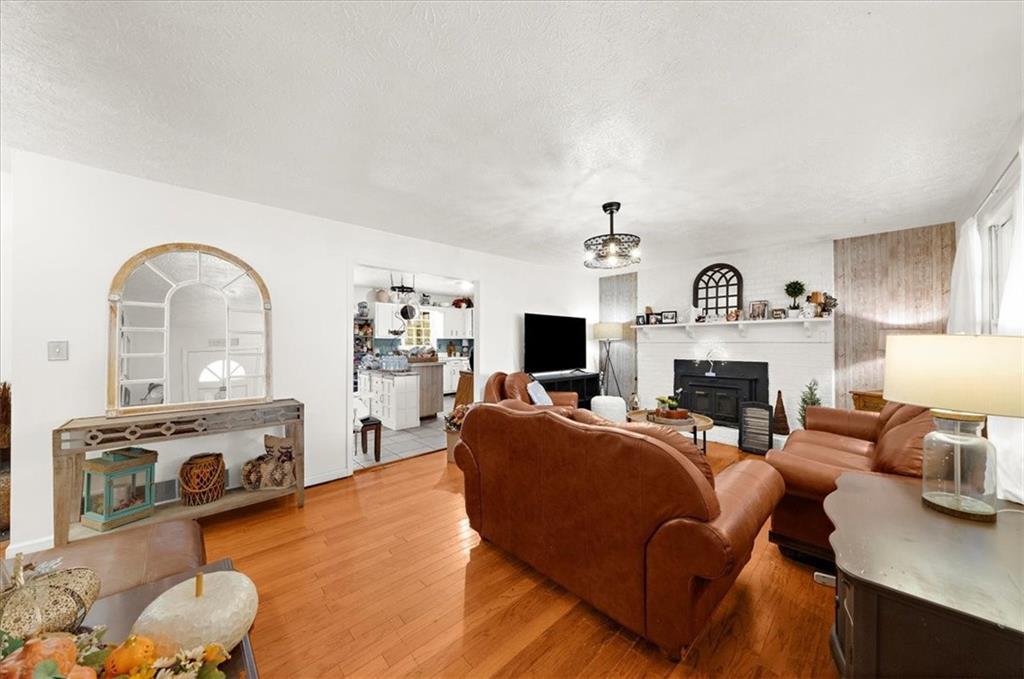 1059 Old Alabama Road Southwest Mableton, GA 30126 - Photo 7 of 33 a living room with furniture and a fireplace