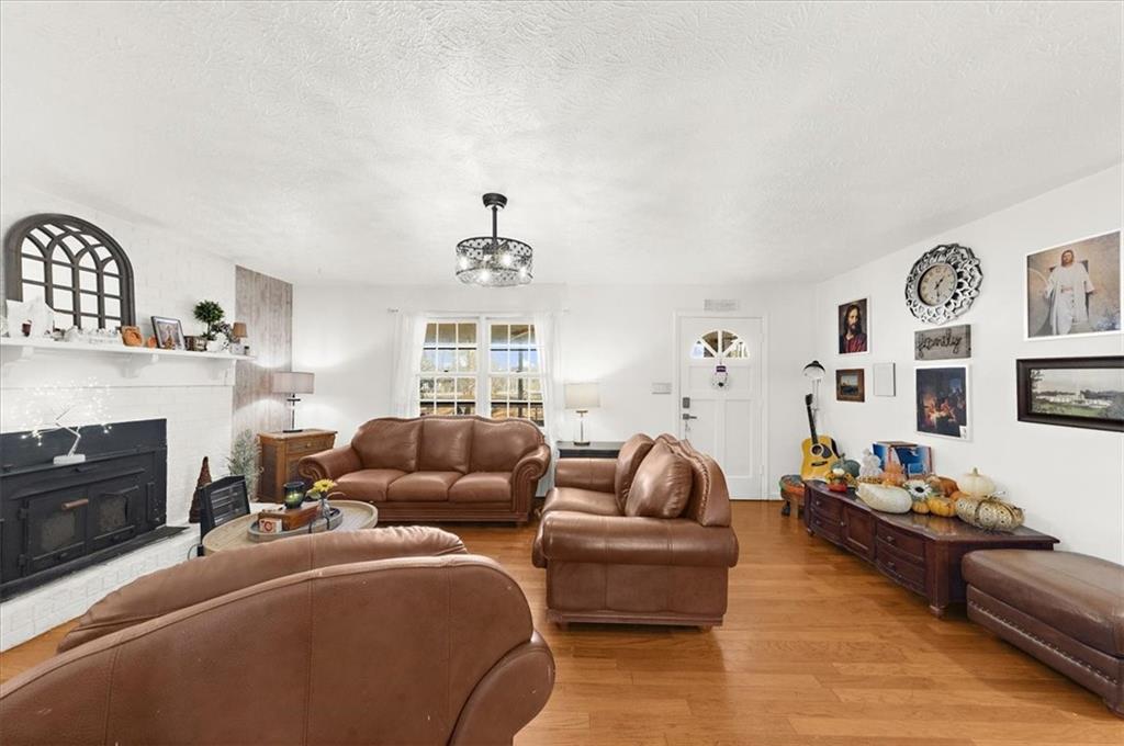 1059 Old Alabama Road Southwest Mableton, GA 30126 - Photo 9 of 33 a living room with furniture and a fireplace