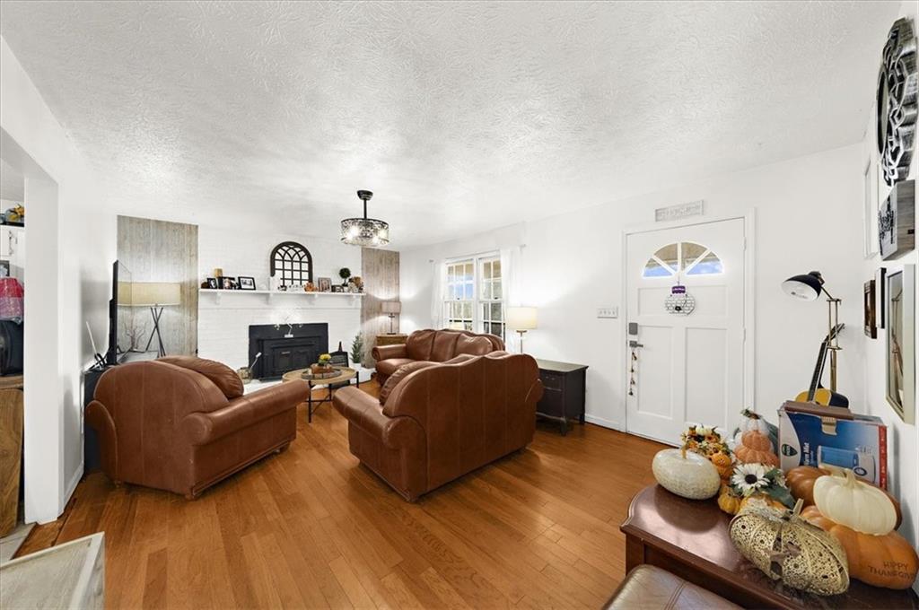 1059 Old Alabama Road Southwest Mableton, GA 30126 - Photo 10 of 33 a living room with furniture and a fireplace