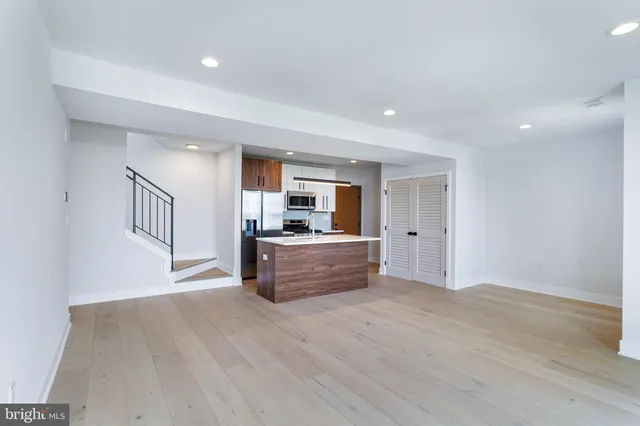 a view of kitchen with wooden floor