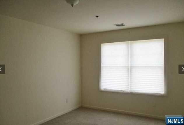 380-382 Anderson Avenue, Unit C1 Cliffside Park, NJ 07010 - Photo 11 of 17 an empty room with a window