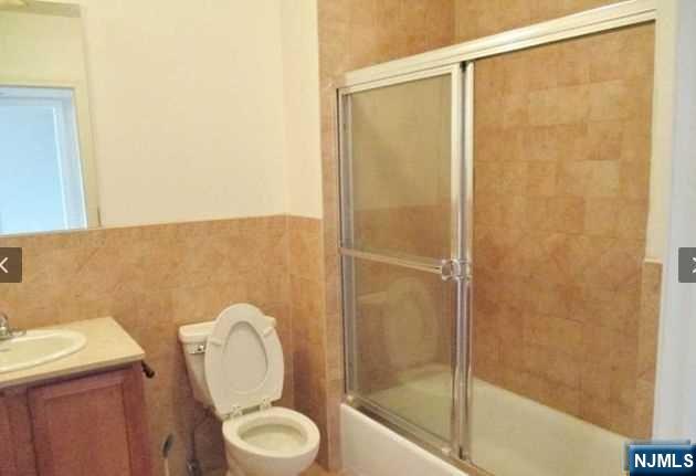 380-382 Anderson Avenue, Unit C1 Cliffside Park, NJ 07010 - Photo 14 of 17 a bathroom with a toilet and a shower