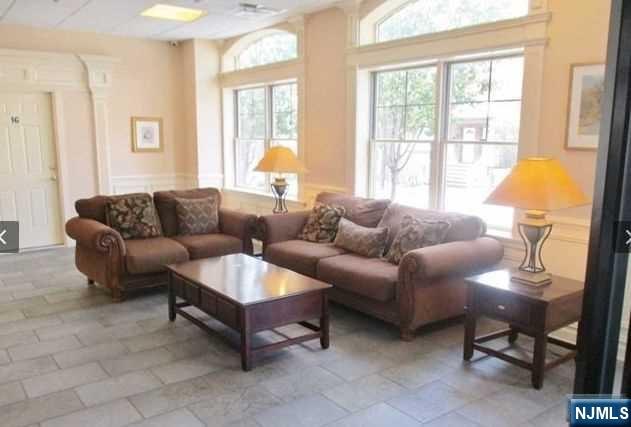 380-382 Anderson Avenue, Unit C1 Cliffside Park, NJ 07010 - Photo 3 of 17 a living room with furniture and a large window