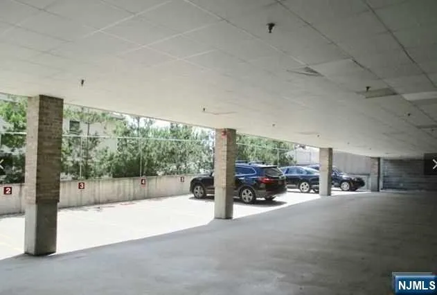 a bathroom with a shower and a sink