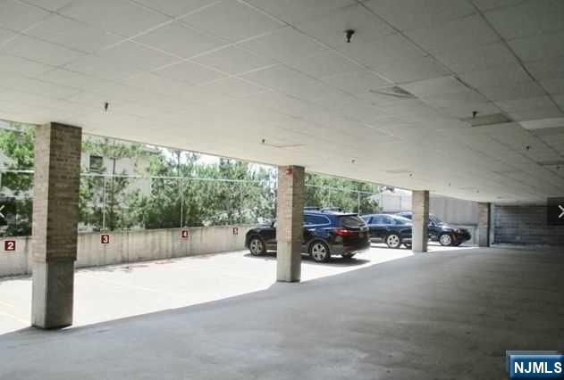 380-382 Anderson Avenue, Unit C1 Cliffside Park, NJ 07010 - Photo 4 of 17 a view of a parking area
